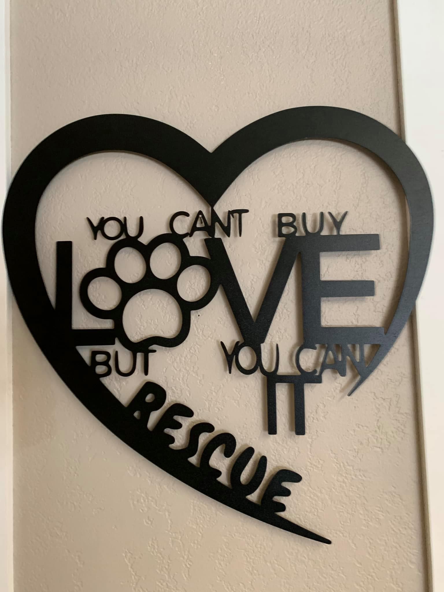 Heart wall art with the quote: You can't buy love but you can rescue it